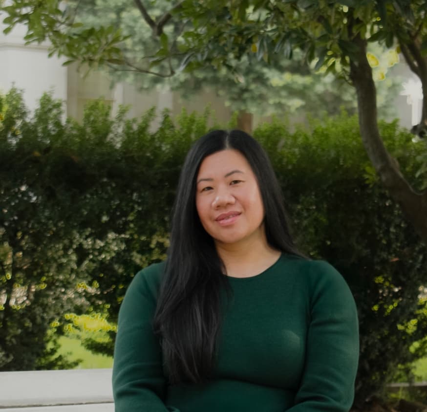 Jennifer Evans, PMHNP, seated outdoors